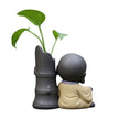 Sculpture En Argile Figurine Moine Calme Avec Plante