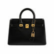 Vase Gros Forme Sac à Main noir avec anses arrondies, détails dorés et design décoratif original inspiré d’un sac à main élégant.